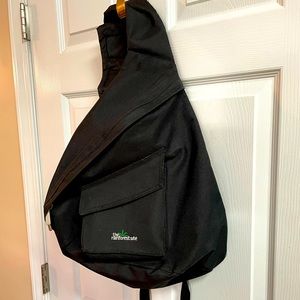 Sling backpack. Adjustable Velcro sling strap and adjustable waist straps.